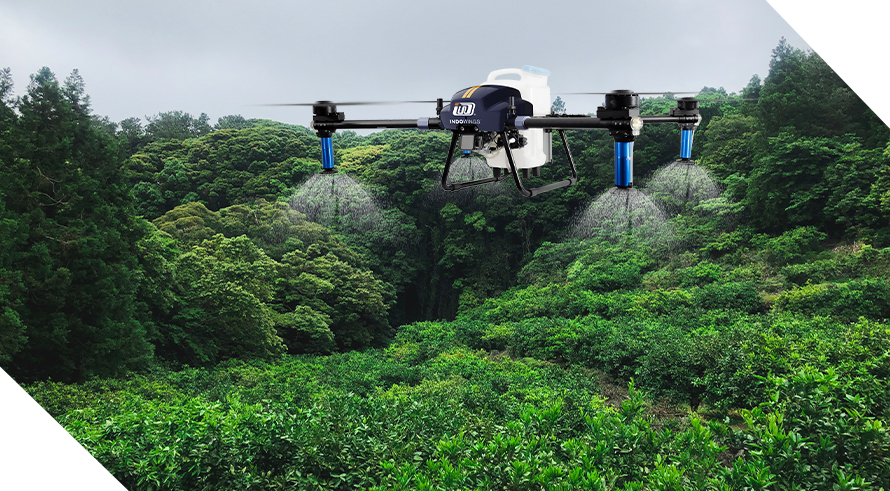 Green crops with sky view with e-series pro of agricultural drone is spraying water onto the crops.